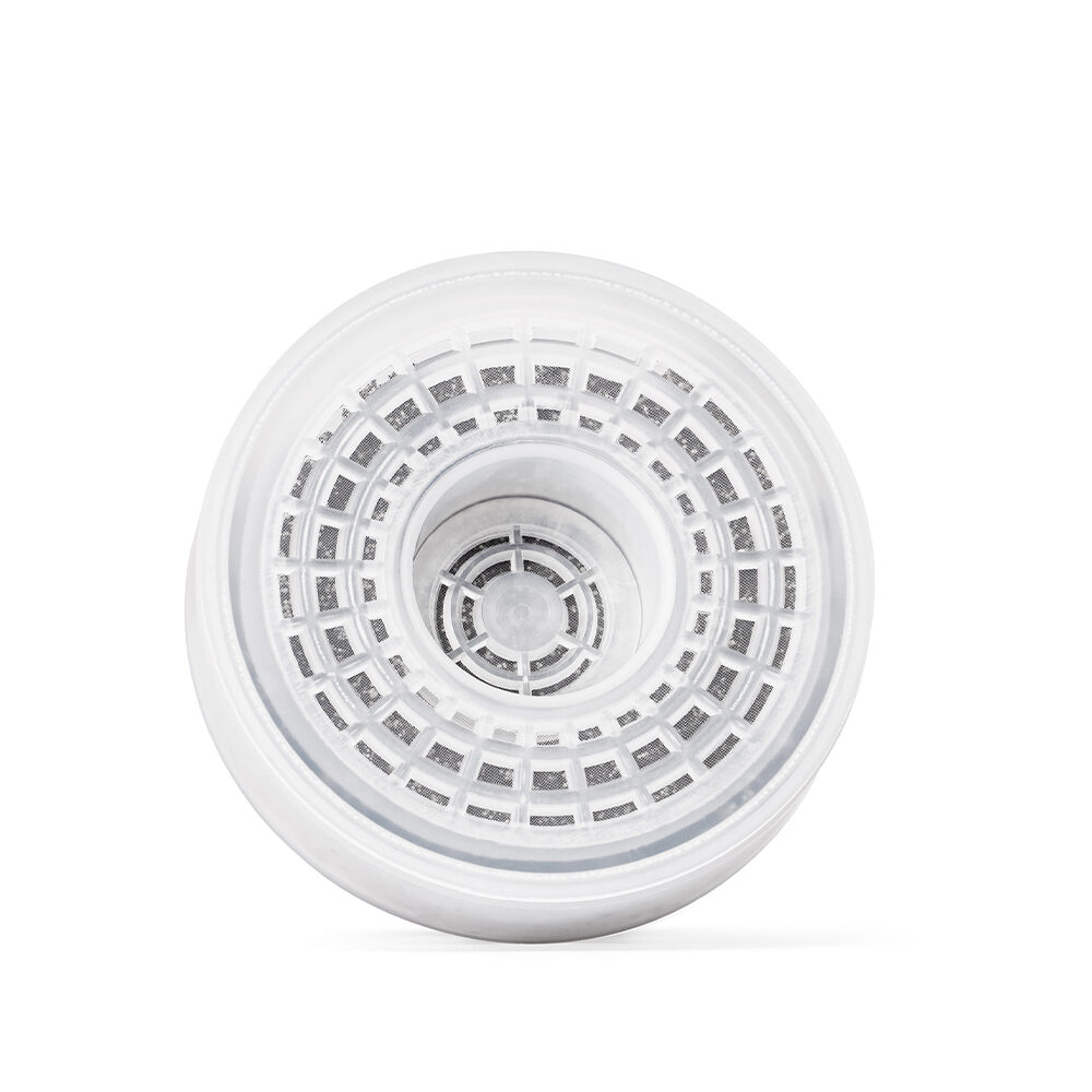 Aufsicht auf das weiße, runde und wiederbefüllbare Kalkfilter-Gehäuse für einen Wasserfilter von Lotus Vita.